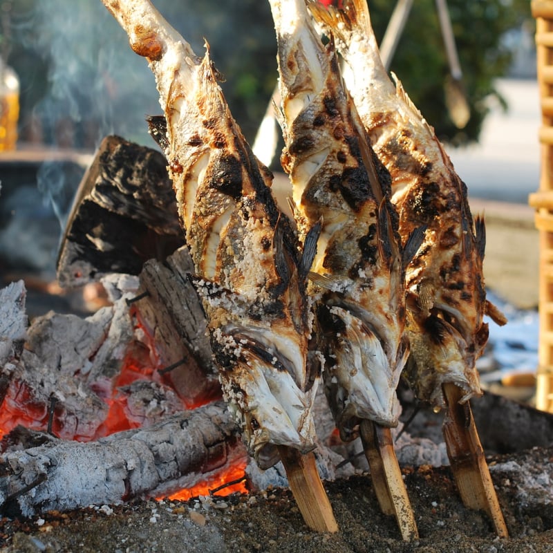 Enjoy a Ghanaian fish BBQ on the beach 